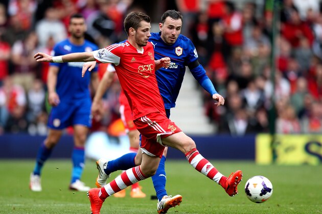 SOUTHAMPTON, ENGLAND - APRIL 12: Morgan Schneiderlin of Southampton passes under pressure from Jordan Mutch of Cardiff during the Barclays Premier League match between Southampton and Cardiff City at St Mary's Stadium on April 12, 2014 in Southampton, England.  (Photo by Ben Hoskins/Getty Images)