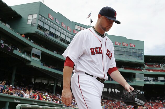 Boston Red Sox starting pitcher Jon Lester heads to the bull pen before a baseball game against the Kansas City Royals in Boston, Sunday, July 20, 2014. (AP Photo/Michael Dwyer)