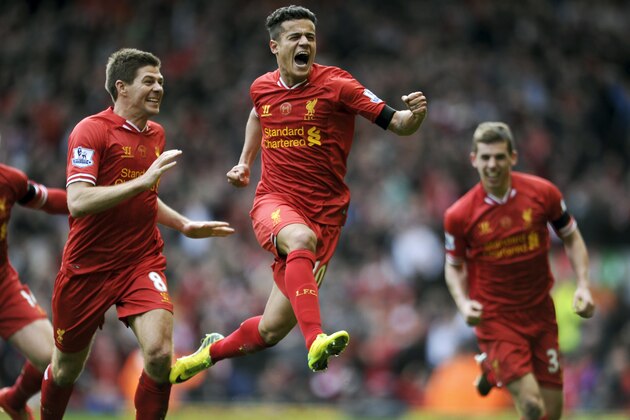 10ThingstoSeeSports - Liverpool's Philippe Coutinho, center, celebrates with teammate Steven Gerrard, left, after he scored the third goal of the game for his side during their English Premier League soccer match against Manchester City at Anfield in Liverpool, England, Sunday, April 13, 2014. (AP Photo/Clint Hughes, File)