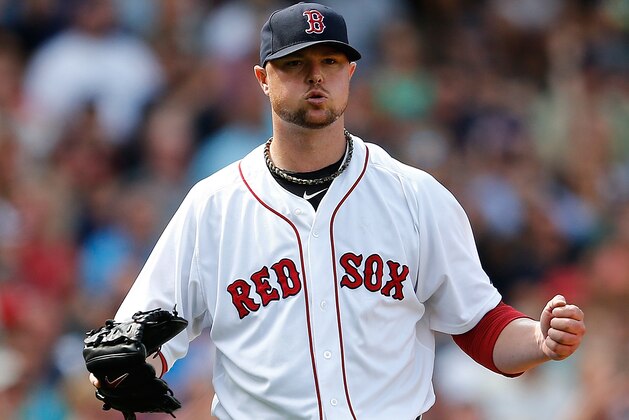BOSTON, MA - JULY 20: Jon Lester #31 of the Boston Red Sox reacts after getting out of trouble in the sixth inning against the Kansas City Royals at Fenway Park on July 20, 2014 in Boston, Massachusetts.  (Photo by Jim Rogash/Getty Images)