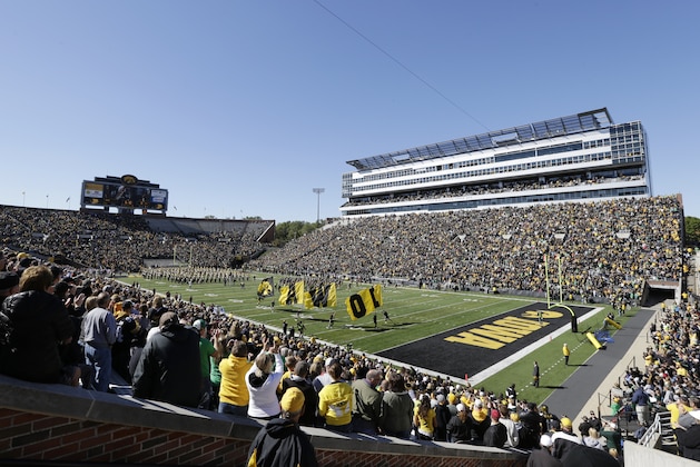Fans in Kinnick Stadium cheer before an NCAA college football game between Iowa and Central Michigan, Saturday, Sept. 22, 2012, in Iowa City, Iowa. (AP Photo/Charlie Neibergall)