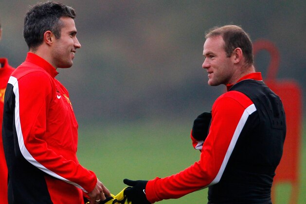 MANCHESTER, ENGLAND - OCTOBER 01: Wayne Rooney (R) and Robin van Persie of Manchester United talk during a training session ahead of their Champions League Group A match against Shakhtar Donetsk at their Carrington Training Complex on October 01, 2013 in Manchester, England (Photo by Paul Thomas/Getty Images)