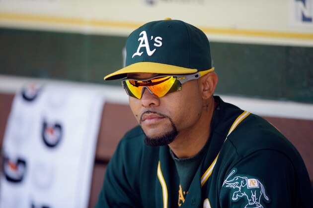 OAKLAND, CA - APRIL 19:  Coco Crisp #4 of the Oakland Athletics sits in the dugout before their game against the Houston Astros at O.co Coliseum on April 19, 2014 in Oakland, California.  (Photo by Ezra Shaw/Getty Images)