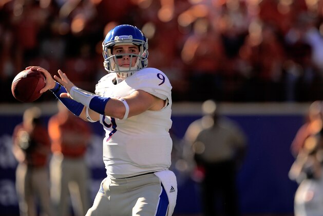 AUSTIN, TX - NOVEMBER 02: Jake Heaps #9 of the Kansas Jayhawks drops back to pass against the Texas Longhorns during a game at Darrell K Royal-Texas Memorial Stadium on November 2, 2013 in Austin, Texas. Texas won the game 35-13. (Photo by Stacy Revere/Getty Images) AUSTIN, TX - NOVEMBER 02: Jake Heaps #9 of the Kansas Jayhawks drops back to pass against the Texas Longhorns during a game at Darrell K Royal-Texas Memorial Stadium on November 2, 2013 in Austin, Texas. Texas won the game 35-13. (Photo by Stacy Revere/Getty Images)