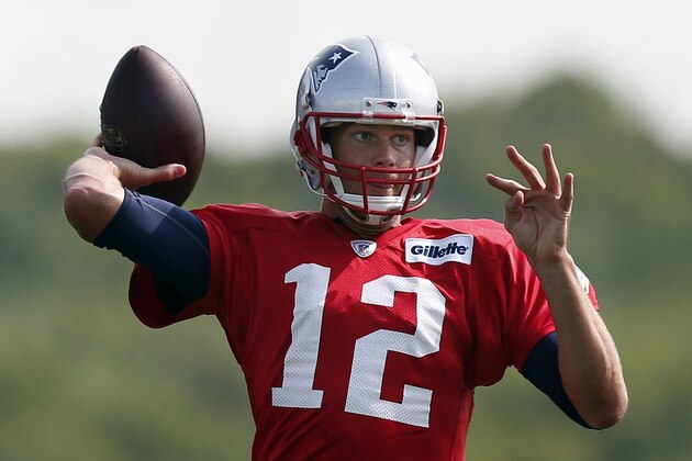 New England Patriots quarterback Tom Brady passes during NFL football training camp in Foxborough, Mass., Saturday, July 26, 2014. (AP Photo)