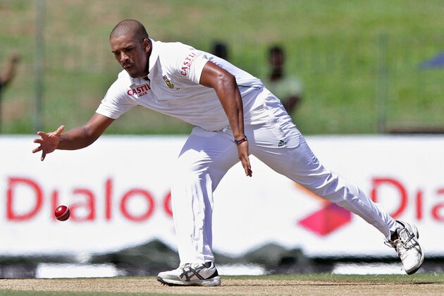 South African bowler Vernon Philander tries to stop the ball during the first day of the second test cricket match between Sri Lanka and South Africa in Colombo, Sri Lanka, Thursday, July 24, 2014. (AP Photo/Sanka Gayashan)