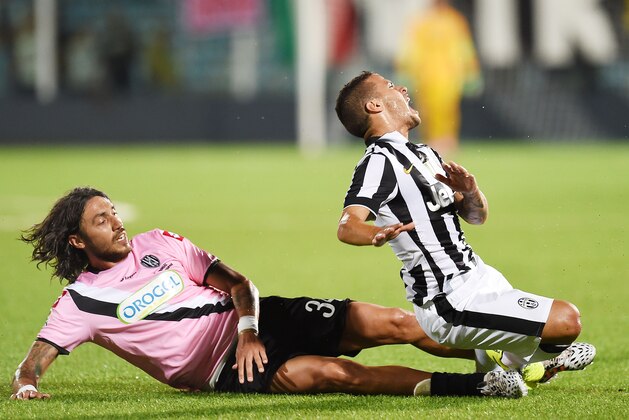 CESENA, ITALY - JULY 30:  Emmanuel Cascione of Cesena and Sebastian Giovinco of Juventus in action during the pre-season friendly match between AC Cesena and Juventus FC at Dino Manuzzi Stadium on July 30, 2014 in Cesena, Italy.  (Photo by Giuseppe Bellini/Getty Images)
