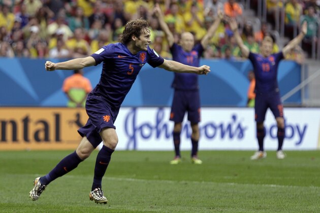 Netherlands' Daley Blind celebrates after scoring his side's second goal during the World Cup third-place soccer match between Brazil and the Netherlands at the Estadio Nacional in Brasilia, Brazil, Saturday, July 12, 2014. (AP Photo/Natacha Pisarenko)