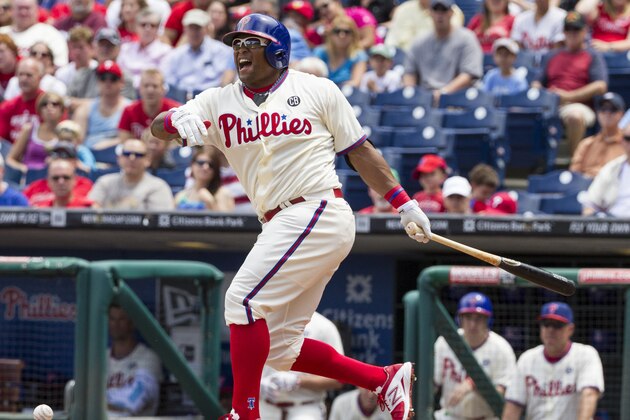 Philadelphia Phillies' Marlon Byrd fouls the ball off his foot during the first inning of a baseball game against the San Francisco Giants, Thursday, July 24, 2014, in Philadelphia. (AP Photo/Chris Szagola)
