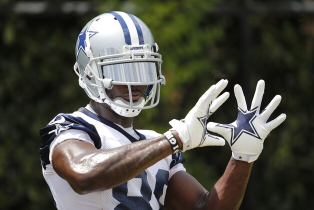 Jun 17, 2014; Dallas, TX, USA; Dallas Cowboys receiver Dez Bryant (88) catches footballs for a drill during minicamp at Cowboys headquarters at Valley Ranch. Mandatory Credit: Matthew Emmons-USA TODAY Sports