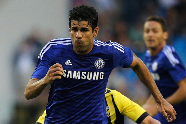 ARNHEM, NETHERLANDS - JULY 30:  Diego Costa of Chelsea gets past Jan-Arie van der Heijden of Vitesse during the pre season friendly match between Vitesse Arnhem and Chelsea at the Gelredome Stadium on July 30, 2014 in Arnhem, Netherlands.  (Photo by Dean Mouhtaropoulos/Getty Images)