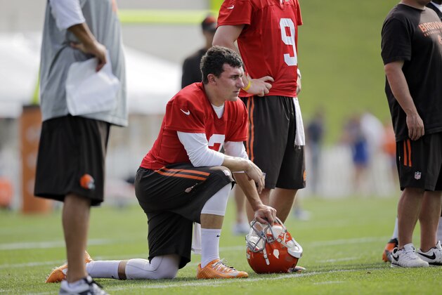Cleveland Browns quarterback Johnny Manziel watches passing drills during an NFL football training camp in Berea, Ohio Sunday, July 27, 2014. (AP Photo/Mark Duncan) Cleveland Browns quarterback Johnny Manziel watches passing drills during an NFL football training camp in Berea, Ohio Sunday, July 27, 2014. (AP Photo/Mark Duncan)