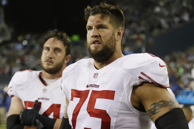 San Francisco 49ers' Alex Boone (75) and Joe Staley watch the field after the NFL football NFC Championship game against the Seattle Seahawks, Sunday, Jan. 19, 2014, in Seattle. The Seahawks won 23-17 to advance to Super Bowl XLVIII. (AP Photo/Marcio Jose Sanchez)