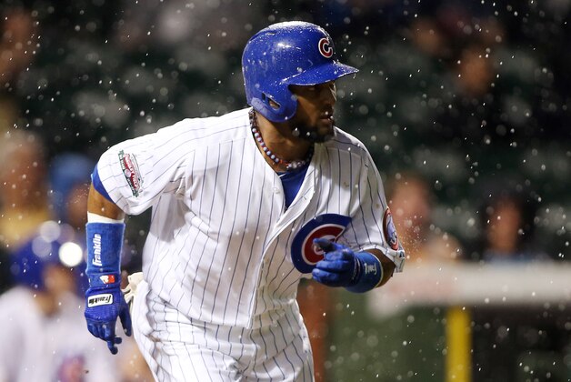 May 20, 2014; Chicago, IL, USA; Chicago Cubs outfielder Emilio Bonifacio (64) hits a RBI single against the New York Yankees during the third inning at Wrigley Field. Mandatory Credit: Jerry Lai-USA TODAY Sports