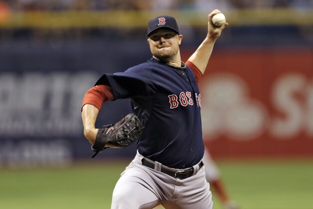Boston Red Sox starting pitcher Jon Lester delayers to the Tampa Bay Rays during the first inning of a baseball game Friday, July 25, 2014, in St. Petersburg, Fla. (AP Photo/Chris O'Meara) Boston Red Sox starting pitcher Jon Lester delayers to the Tampa Bay Rays during the first inning of a baseball game Friday, July 25, 2014, in St. Petersburg, Fla. (AP Photo/Chris O'Meara)