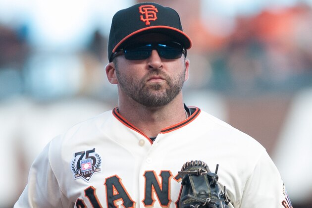 Jul 27, 2014; San Francisco, CA, USA; San Francisco Giants second baseman Dan Uggla (22) returns to the dugout after the fourth inning of the game against the Los Angeles Dodgers at AT&T Park. Mandatory Credit: Ed Szczepanski-USA TODAY Sports