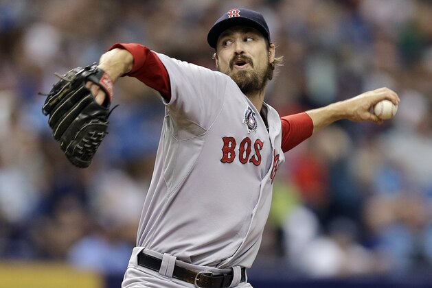 Boston Red Sox relief pitcher Andrew Miller delivers to the Tampa Bay Rays during the seventh inning of a baseball game Sunday, July 27, 2014, in St. Petersburg, Fla. (AP Photo/Chris O'Meara)