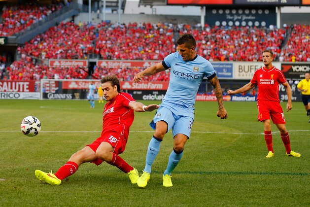 NEW YORK, NY - JULY 30:  Stevan Jovetic #35 of Manchester City and Sebastian Coates #16 of Liverpool vie for the ball during the International Champions Cup 2014 at Yankee Stadium on July 30, 2014 in the Bronx borough of New York City.  (Photo by Mike Stobe/Getty Images)