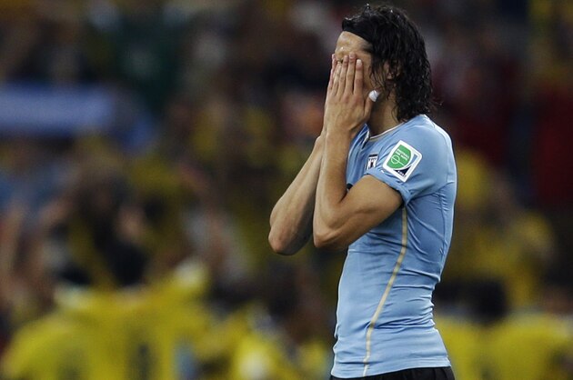 Uruguay's Edinson Cavani reacts after Colombia's James Rodriguez scored his side's second goal during the World Cup round of 16 soccer match between Colombia and Uruguay at the Maracana Stadium in Rio de Janeiro, Brazil, Saturday, June 28, 2014. (AP Photo/Natacha Pisarenko)