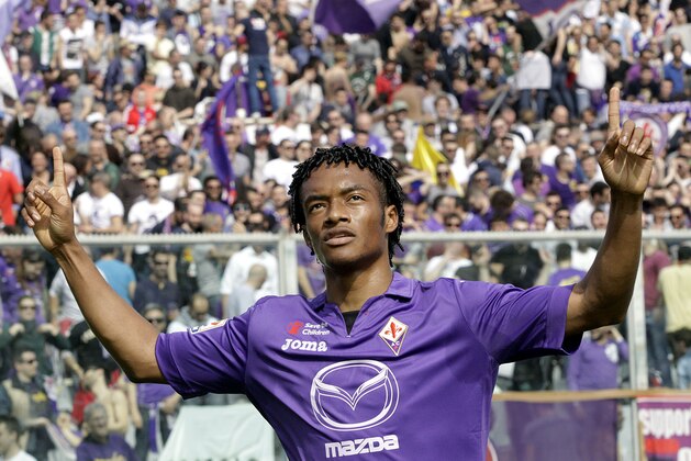Fiorentina's Juan Cuadrado celebrates after scoring during a Serie A soccer match between Fiorentina and Udinese  at the Artemio Franchi stadium in Florence, Italy, Sunday, April 6 2014. (AP Photo/Fabrizio Giovannozzi)