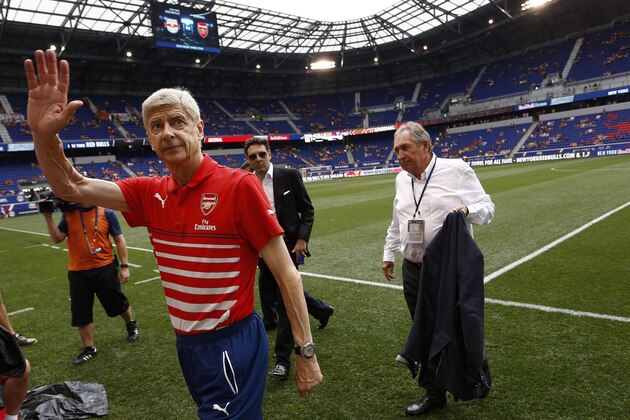 HARRISON, NJ - JULY 26:   Arsene Wenger, head coach of Arsenal, waves to fans before a friendly match against the New York Red Bulls at Red Bull Arena on July 26, 2014 in Harrison, New Jersey. (Photo by Jeff Zelevansky/Getty Images)
