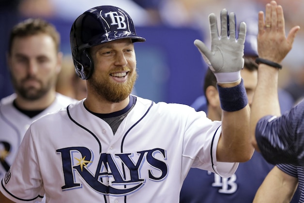 Tampa Bay Rays' Ben Zobrist high fives teammates in the dugout after his home run off Milwaukee Brewers starting pitcher Matt Garza during the sixth inning of an interleague baseball game Tuesday, July 29, 2014, in St. Petersburg, Fla. (AP Photo/Chris O'Meara)