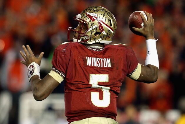 PASADENA, CA - JANUARY 06:  Quarterback Jameis Winston #5 of the Florida State Seminoles looks to pass against the Auburn Tigers in the third quarter of the 2014 Vizio BCS National Championship Game at the Rose Bowl on January 6, 2014 in Pasadena, California.  (Photo by Stephen Dunn/Getty Images)