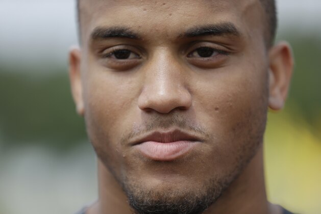 New York Jets cornerback Dee Milliner responds to questions during an interview after practice during NFL football training camp on Saturday, July 26, 2014, in Cortland, N.Y.  (AP Photo/Frank Franklin II)