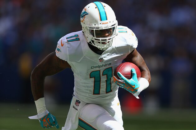 INDIANAPOLIS, IN - SEPTEMBER 15:  Mike Wallace #11 of the Miami Dolphins runs for a touchdown during the NFL game against the Indianapolis Colts at Lucas Oil Stadium on September 15, 2013 in Indianapolis, Indiana.  (Photo by Andy Lyons/Getty Images)