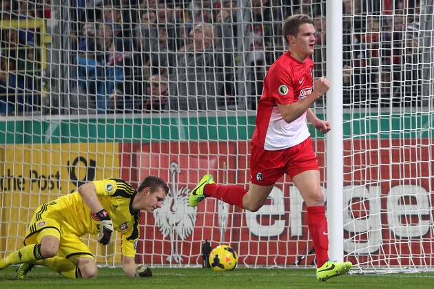 Freiburg's Matthias Ginter celebrates his side's opening goal during a round of 16 German soccer cup match between SC Freiburg and Bayer Leverkusen in Freiburg, Germany, Wednesday, Dec. 4, 2013. (AP Photo/Michael Probst)