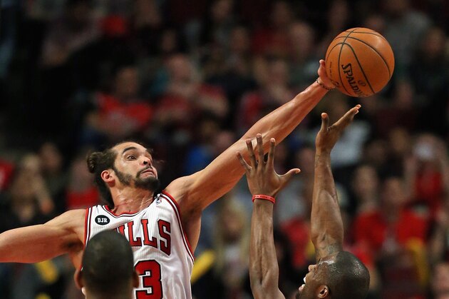 CHICAGO, IL - APRIL 11: Joakim Noah #13 of the Chicago Bulls blocks a shot by Rodney Stuckey #3 of the Detroit Pistons at the United Center on April 11, 2014 in Chicago, Illinois. The Bulls defeated the Pistons 106-98. NOTE TO USER: User expressly acknowledges and agrees that, by downloading and or using this photograph, User is consenting to the terms and conditions of the Getty Images License Agreement. (Photo by Jonathan Daniel/Getty Images)