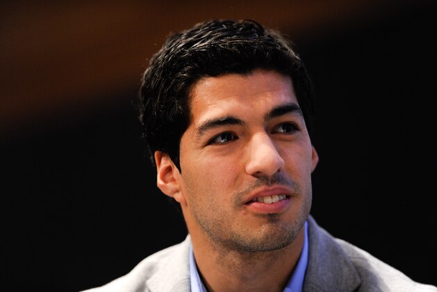 BARCELONA, SPAIN - MAY 14:  Luis Suarez of Liverpool faces the media during the presentation as new Ambassador for 888poker on May 14, 2014 in Barcelona, Spain.  (Photo by David Ramos/Getty Images)