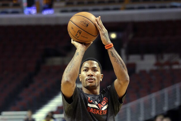 Chicago Bulls guard Derrick Rose warms up before an NBA basketball game against the New York Knicks in Chicago, Thursday, Oct. 31, 2013. (AP Photo/Nam Y. Huh)