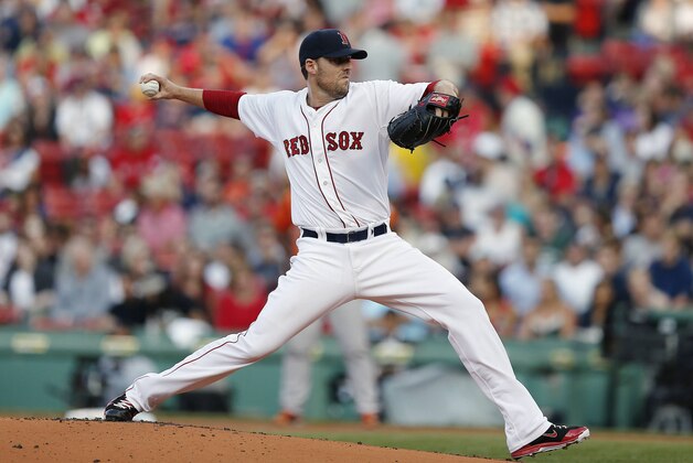Boston Red Sox's John Lackey pitches in the first inning of the second game of a baseball doubleheader against the Baltimore Orioles in Boston, Saturday, July 5, 2014. (AP Photo/Michael Dwyer)