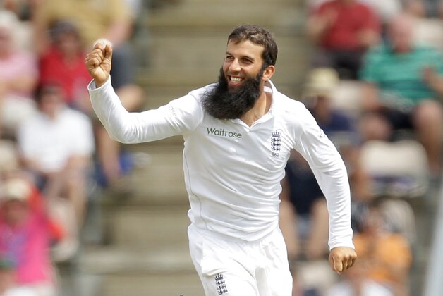 England's Moeen Ali celebrates bowling out India's Mohammed Shami, during the fifth and final day of the third cricket test match of the series between England and India at The Ageas Bowl in Southampton, England, Thursday, July 31, 2014. (AP Photo/Matt Dunham)