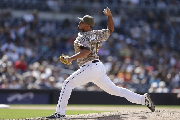 San Diego Padres relief pitcher Joaquin Benoit pitches to a Miami Marlins batter during the eighth inning of a baseball game Sunday, May 11, 2014, in San Diego. (AP Photo/Gregory Bull)
