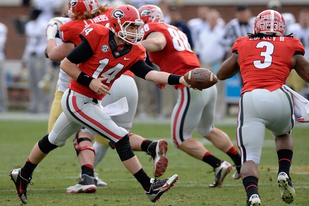 Georgia quarterback Hutson Mason (14) hands off to Todd Gurley (3) during the first half of an NCAA football game against Georgia Tech on Saturday, Nov. 30, 2013, in Atlanta. (AP Photo/David Tulis)