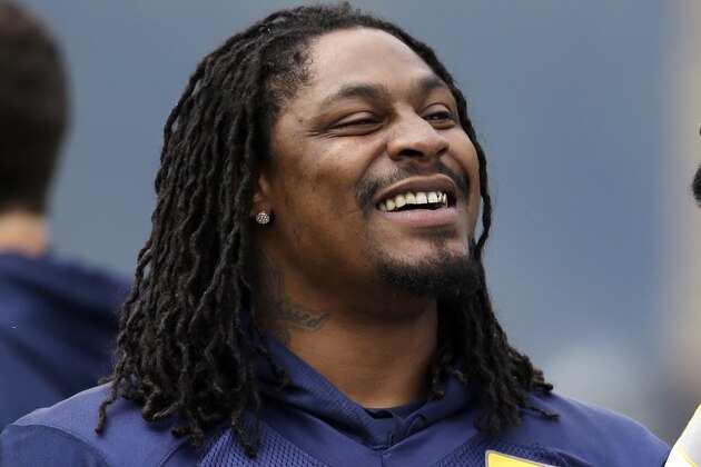 Seattle Seahawks' Marshawn Lynch stands on the field at an NFL football minicamp practice Wednesday, June 18, 2014, in Renton, Wash. (AP Photo/Elaine Thompson)