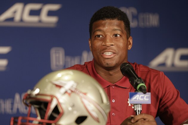 Florida State's Jameis Winston answers a question during a news conference at the Atlantic Coast Conference Football kickoff in Greensboro, N.C., Sunday, July 20, 2014. (AP Photo/Chuck Burton)