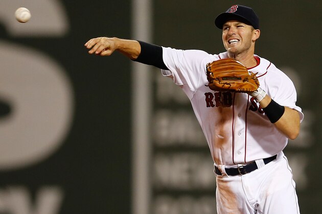 BOSTON, MA - JULY 1: Stephen Drew #7 of the Boston Red Sox makes the out on Justin Ruggiano #20 of the Chicago Cubs at second base but a run scored on the play in the sixth  inning on a fielder's choice at Fenway Park on July 1, 2014 in Boston, Massachusetts.  (Photo by Jim Rogash/Getty Images)