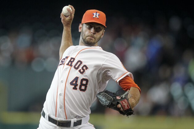 Houston Astros pitcher Jarred Cosart throws during the first inning of a baseball game against the Miami Marlins, Saturday, July 26, 2014, in Houston. (AP Photo/Patric Schneider)