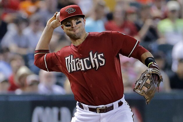 Arizona Diamondbacks' Martin Prado throws against the Miami Marlins during the fifth inning of a baseball game, Wednesday, July 9, 2014, in Phoenix. (AP Photo/Matt York)