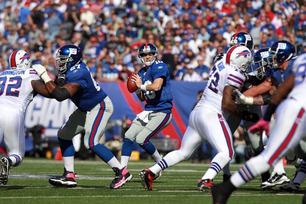 EAST RUTHERFORD, NJ - OCTOBER 16:  Eli Manning #10 of the New York Giants looks to pass against the Buffalo Bills at MetLife Stadium on October 16, 2011 in East Rutherford, New Jersey.  (Photo by Nick Laham/Getty Images)