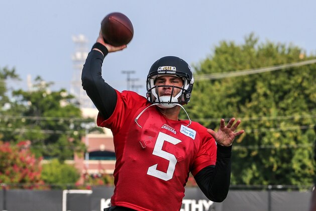 Jacksonville Jaguars quarterback Blake Bortles (5) warms up at NFL football practice, first day with pads on Wednesday, July 30, 2014 in Jacksonville, Fla. (AP Photo/Gary McCullough)