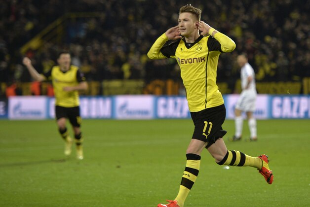 Dortmund's Marco Reus celebrates scoring his side's 2nd goal during the Champions League quarterfinal second leg soccer match between Borussia Dortmund and Real Madrid in the Signal Iduna stadium in Dortmund, Germany, Tuesday, April 8, 2014. (AP Photo/Martin Meissner)