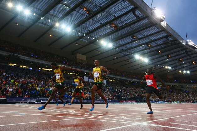 GLASGOW, SCOTLAND - JULY 31: (L-R) Bronze medalist Jason Livermore of Jamaica, gold medalist Rasheed Dwyer of Jamaica and silver medalist Warren Weir of Jamaica cross the line in the Men's 200 metres Final at Hampden Park during day eight of the Glasgow 2014 Commonwealth Games on July 31, 2014 in Glasgow, United Kingdom. (Photo by Ian Walton/Getty Images) GLASGOW, SCOTLAND - JULY 31: (L-R) Bronze medalist Jason Livermore of Jamaica, gold medalist Rasheed Dwyer of Jamaica and silver medalist Warren Weir of Jamaica cross the line in the Men's 200 metres Final at Hampden Park during day eight of the Glasgow 2014 Commonwealth Games on July 31, 2014 in Glasgow, United Kingdom. (Photo by Ian Walton/Getty Images)