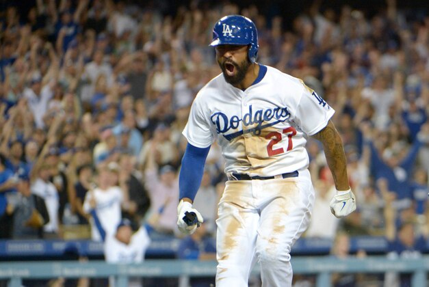 Jul 30, 2014; Los Angeles, CA, USA; Los Angeles Dodgers right fielder Matt Kemp (27) celebrates after scoring in the eighth inning against the Atlanta Braves at Dodger Stadium. The Dodgers defeated the Braves 2-1 in 10 innings. Mandatory Credit: Kirby Lee-USA TODAY Sports Jul 30, 2014; Los Angeles, CA, USA; Los Angeles Dodgers right fielder Matt Kemp (27) celebrates after scoring in the eighth inning against the Atlanta Braves at Dodger Stadium. The Dodgers defeated the Braves 2-1 in 10 innings. Mandatory Credit: Kirby Lee-USA TODAY Sports