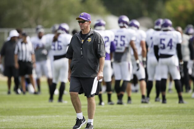 Minnesota Vikings head coach Mike Zimmer watches his team during an NFL football training camp practice, Wednesday, July 30, 2014, in Mankato, Minn. (AP Photo/Charlie Neibergall)