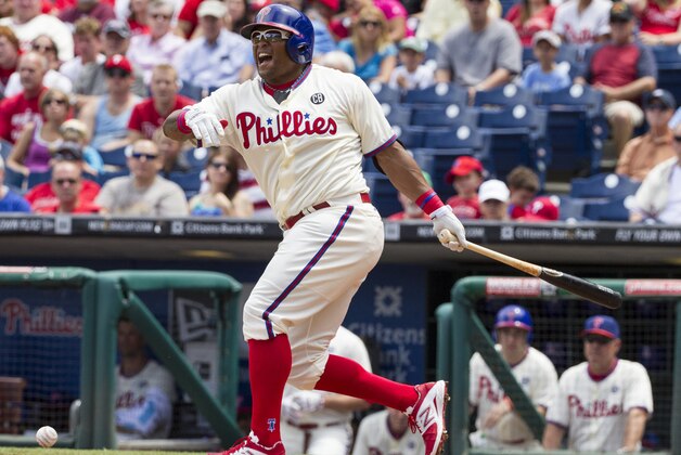 Philadelphia Phillies' Marlon Byrd fouls the ball off his foot during the first inning of a baseball game against the San Francisco Giants, Thursday, July 24, 2014, in Philadelphia. (AP Photo/Chris Szagola)