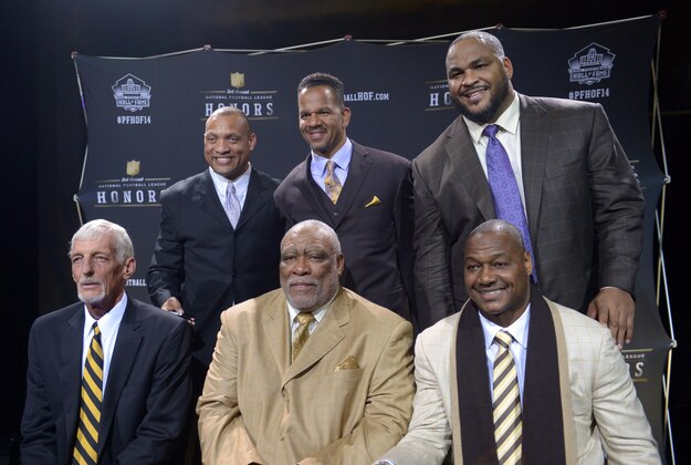 Feb 1, 2014; New  York, NY, USA; Members of the 2014 Pro Football Hall of Fame class pose at the 3rd NFL Honors at Radio Music City Hall. Front row (from left): Ray Guy and Claude Humphrey and Derrick Brooks. Back row: Aeneas Williams and Andre Reed and Walter Jones. Mandatory Credit: Kirby Lee-USA TODAY Sports